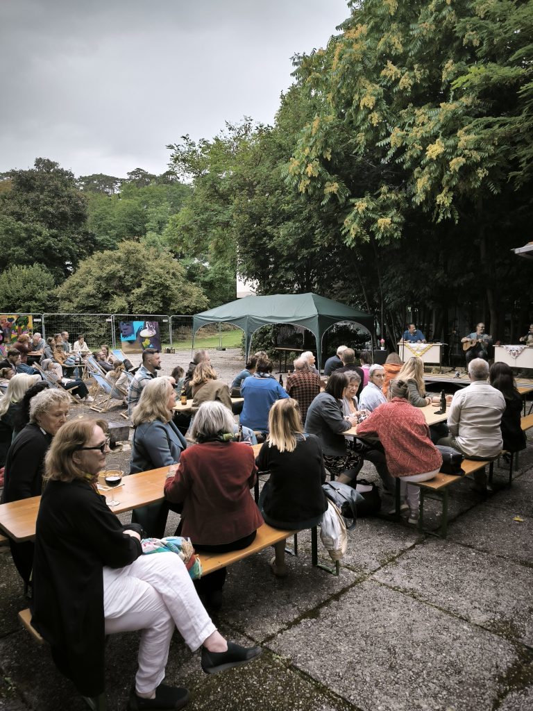 people at a concert at the patio at the transformarte art fair in Eisenstadt 2025
