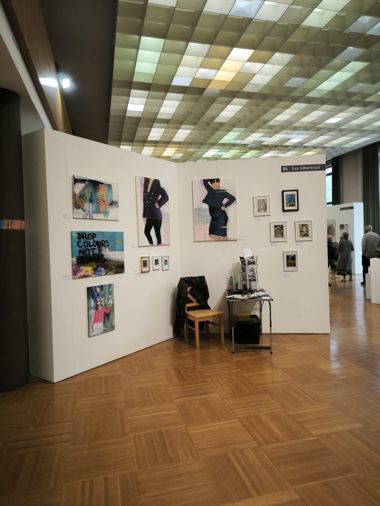 looking at the booth of Eva Silberknoll showing all her artworks at the transformarte art fair in Eisenstadt 2025