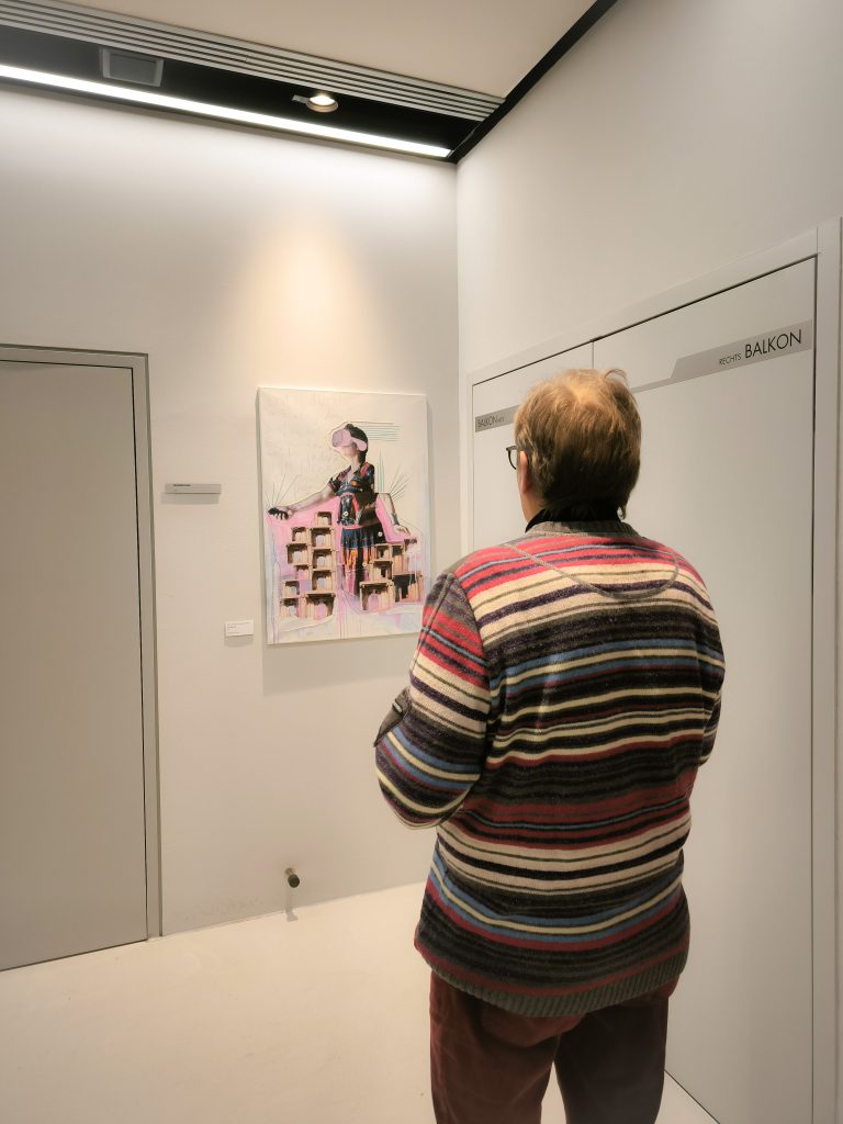 a man looking at my artwork
