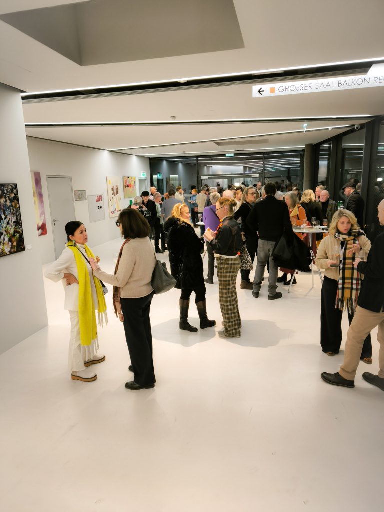 people talking at the exhibiton space