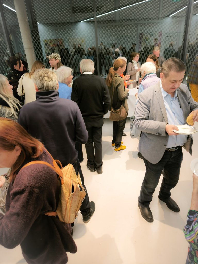 people talking at the vernissage close up