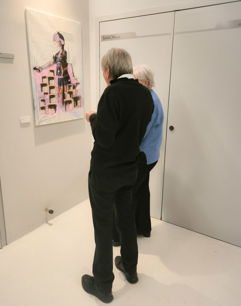 a couple looking at my artwork